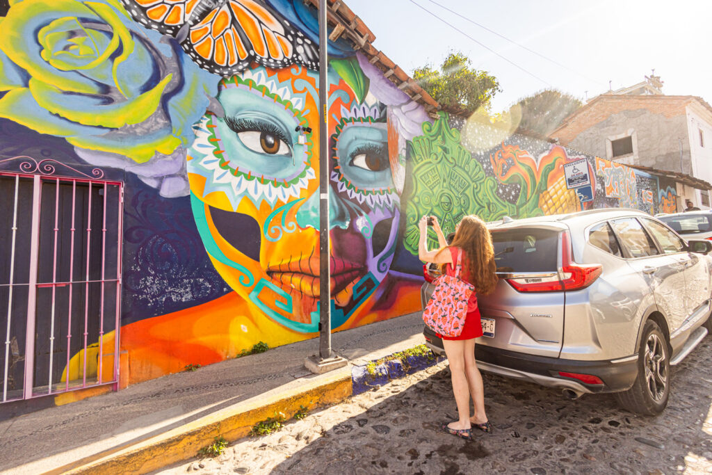 Sarah photographing the street art in Puerto Vallarta.