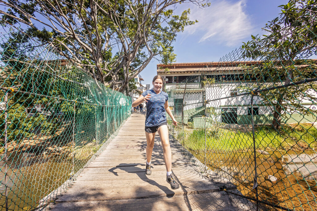 A candid shot of Kaia wandering through a vibrant Mexican market.