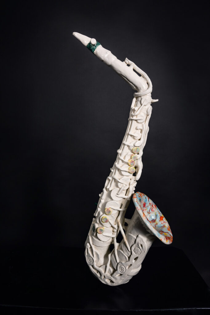 Detailed hand sculpted ceramic saxophone by Tammy Karin