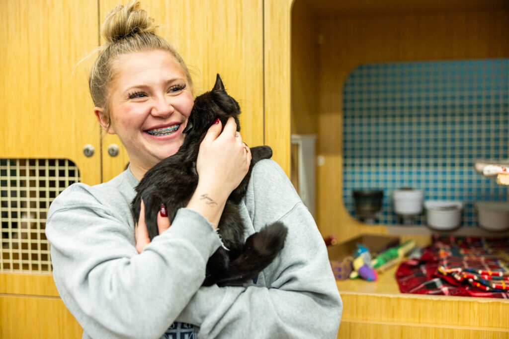 Emotional pet adoption moment at Cattails event Manhattan KS