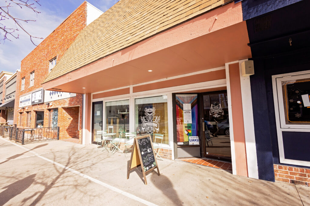 The welcoming storefront of Espurresso Cat Cafe on Massachusetts Street in Lawrence.