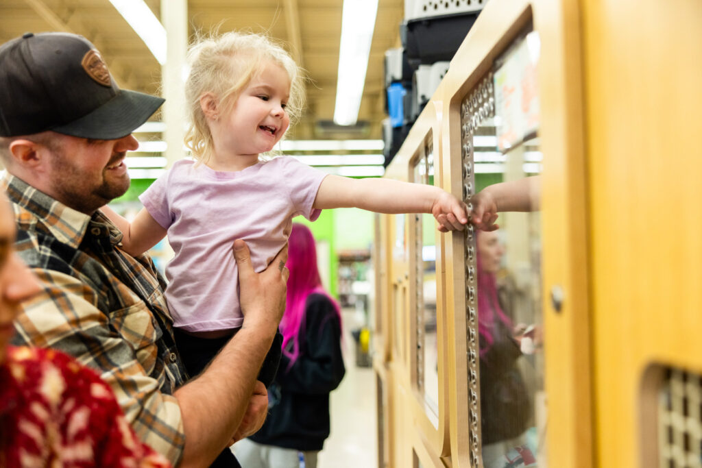 Adorable girl is excited to adopt rescue kitten in Manhattan KS