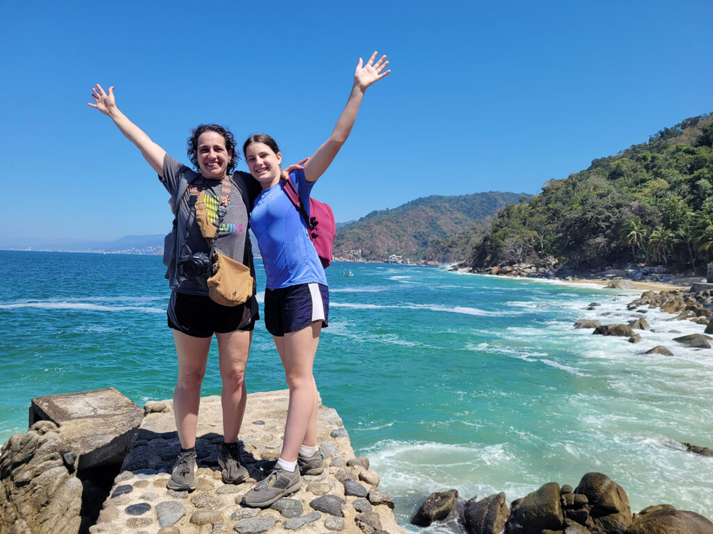 Tammy Karin and Kaia Schmit posing in front of Banderas Bay.