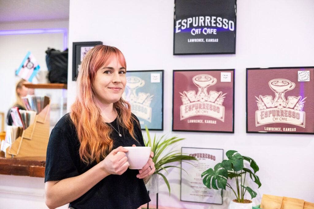 Co-owner Mary Costello sharing the story of the cafe’s mission in Lawrence.