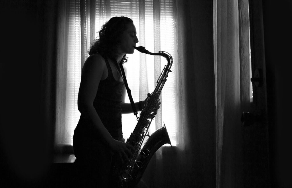 Tammy Karin playing tenor saxophone