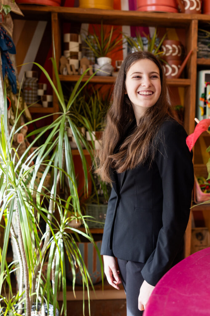 Using natural greenery as a frame for family photos in Lawrence KS.