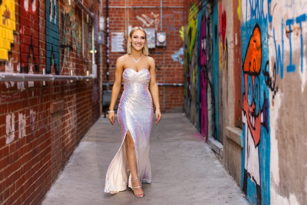 A high school senior owning her glamorous vibe in an Aggieville alley.