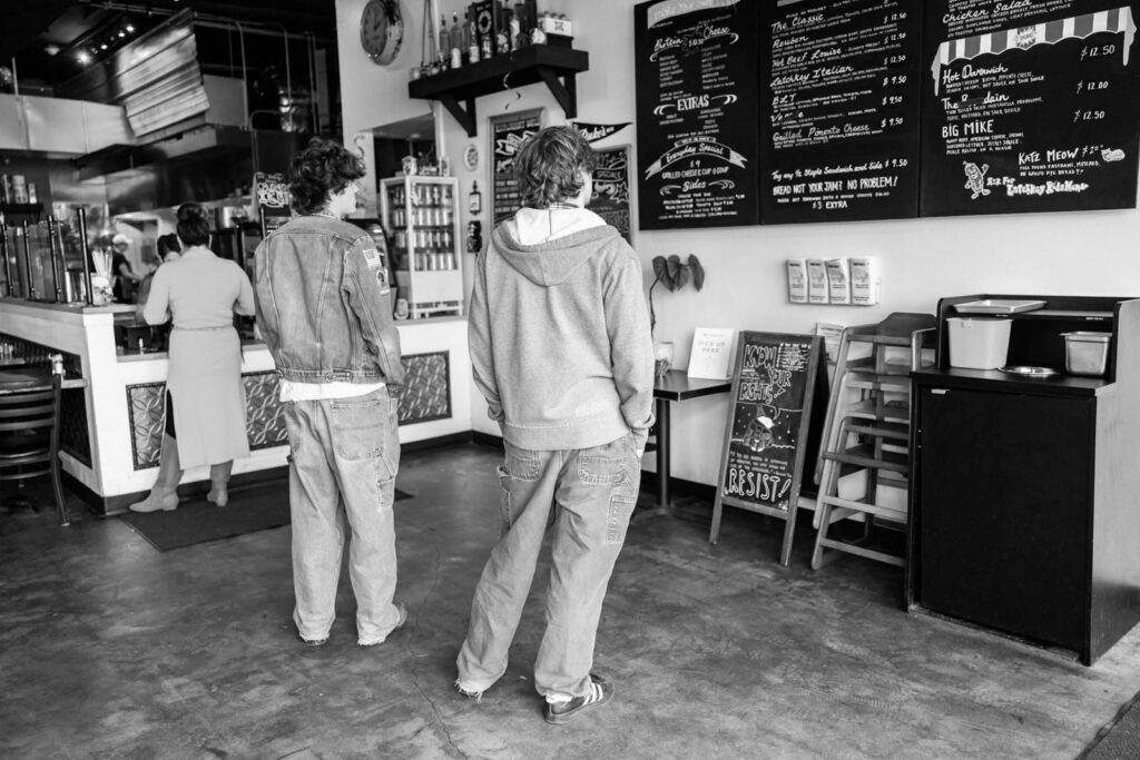 Customers waiting in line at Latchkey Deli.