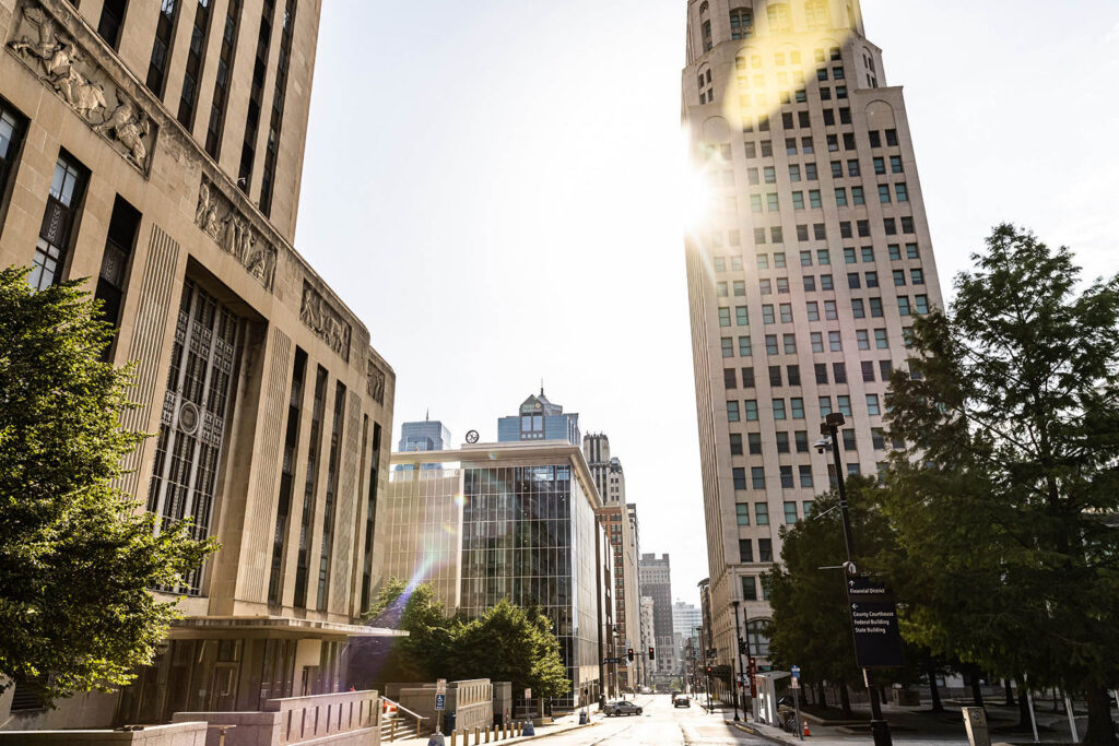 A wide, cinematic shot of a Kansas City street or a main landmark.