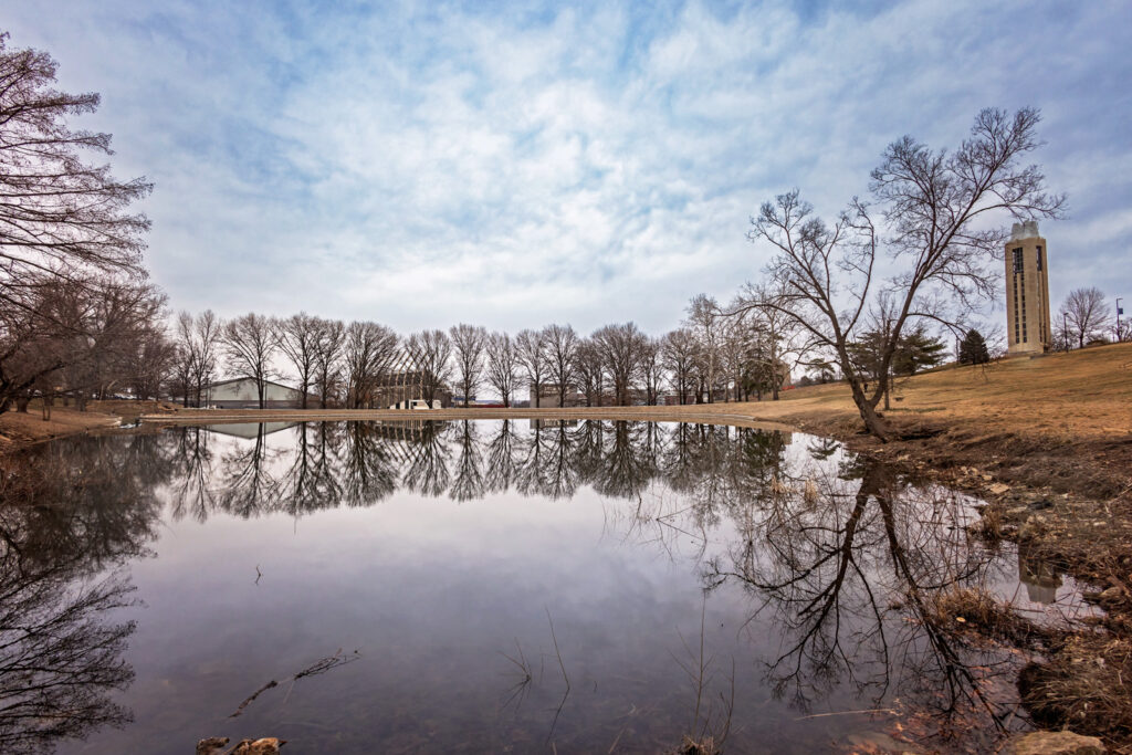The University of Kansas campus offers architectural and natural layers for family photos in Lawrence KS.