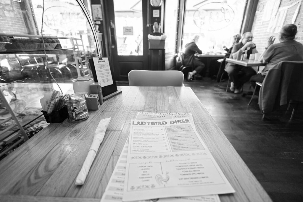 Warm welcome and a menu at Ladybird Diner in Lawrence, KS.