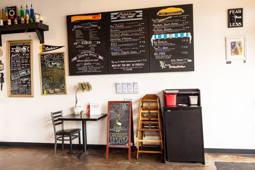 Wall menus at Latchkey Deli in Lawrence.
