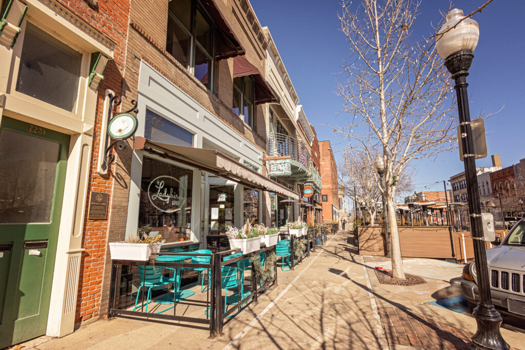 I love the vibrant and historic energy of Mass St. for family photos in Lawrence KS.