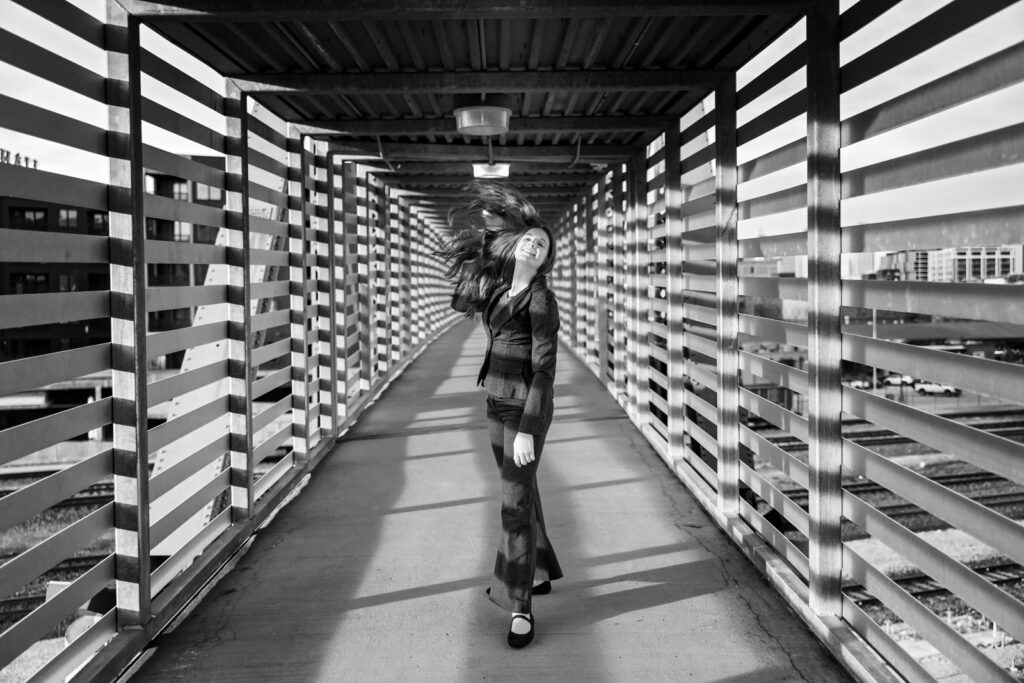 A dramatic portrait utilizing the leading lines of the Link bridge in Kansas City.