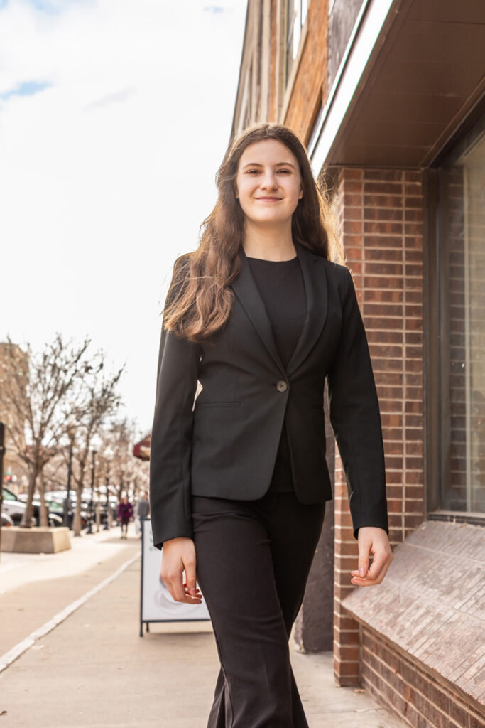 My daughter Kaia exploring the sidewalks of Massachusetts Street in downtown Lawrence.
